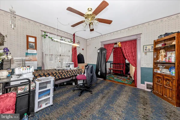 a bedroom with furniture and a chandelier