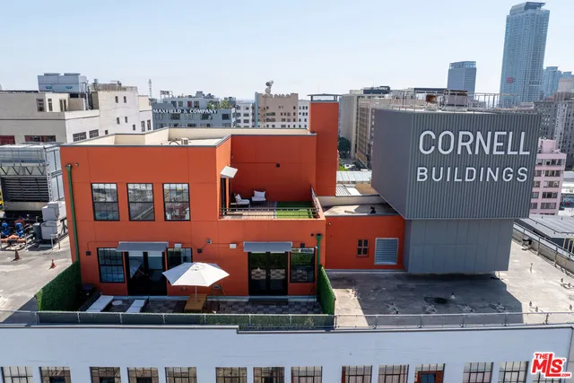 a view of a street with buildings