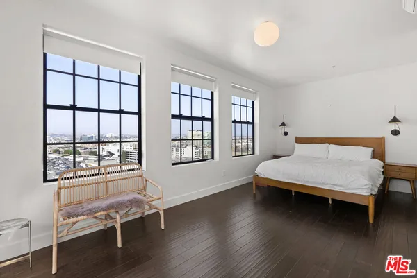 a view of swimming pool with outdoor seating and city view