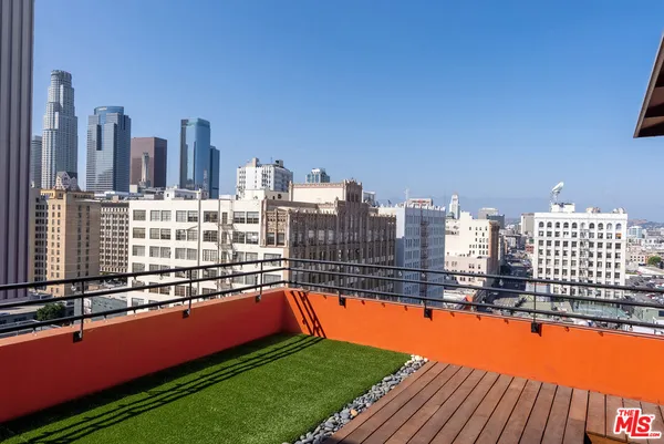 a spacious bathroom with a double vanity sink a mirror a bathtub and shower
