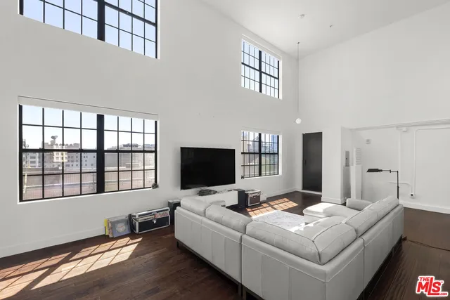 a kitchen with granite countertop stainless steel appliances and wooden cabinets