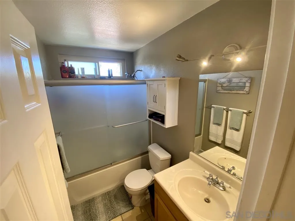 2616 Alpine Boulevard, Unit 29 Alpine, CA 91901 - Photo 13 of 20 a bathroom with a sink toilet and shower