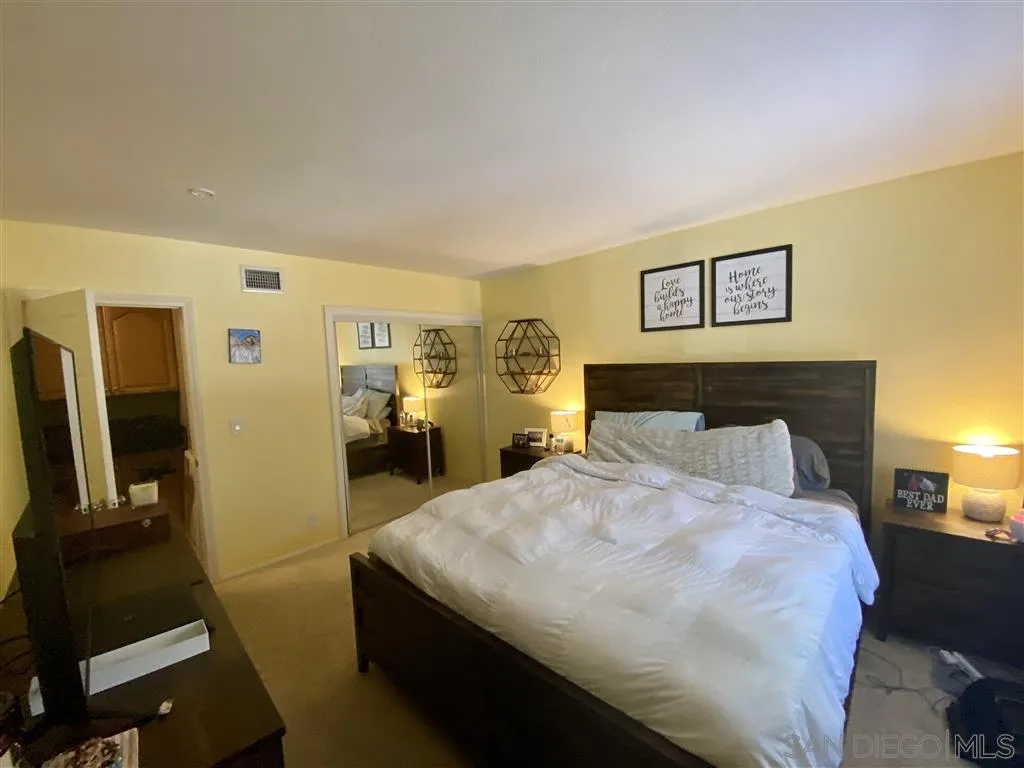 2616 Alpine Boulevard, Unit 29 Alpine, CA 91901 - Photo 14 of 20 a bedroom with a bed and a flat screen tv