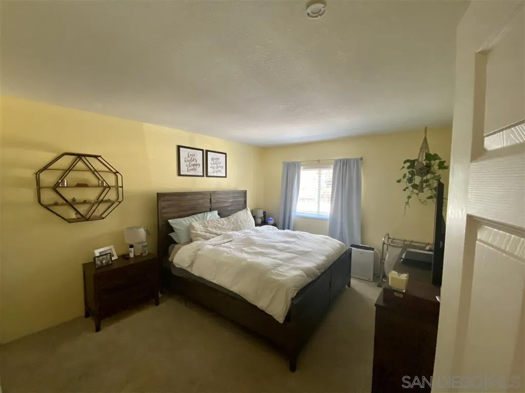 2616 Alpine Boulevard, Unit 29 Alpine, CA 91901 - Photo 16 of 20 a bedroom with a bed and a window