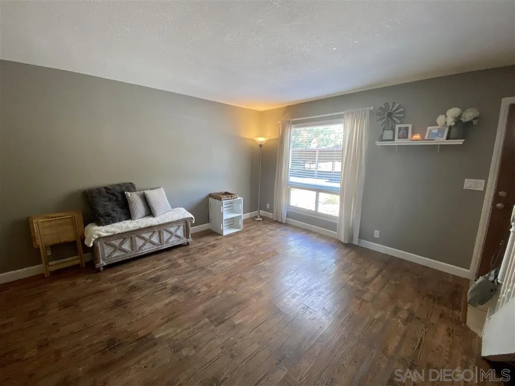2616 Alpine Boulevard, Unit 29 Alpine, CA 91901 - Photo 4 of 20 a living room with furniture and wooden floor