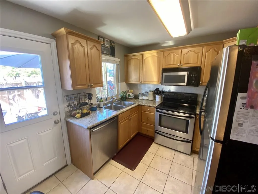 2616 Alpine Boulevard, Unit 29 Alpine, CA 91901 - Photo 7 of 20 a kitchen with a sink stove and refrigerator