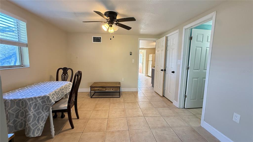 12611 1st Isle Hudson, FL 34667 - Photo 12 of 19 a view of a hallway with workspace and a window