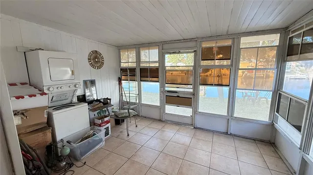 a room with lots of furniture and a large window