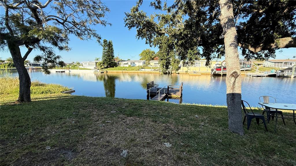 12611 1st Isle Hudson, FL 34667 - Photo 19 of 19 a view of a lake with outdoor seating
