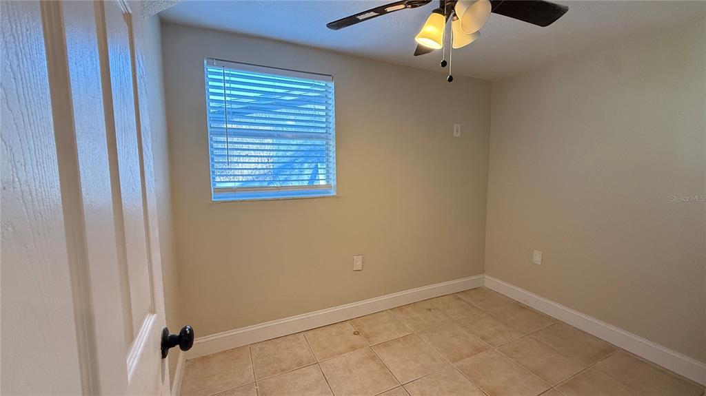 12611 1st Isle Hudson, FL 34667 - Photo 10 of 19 a view of an empty room with a window