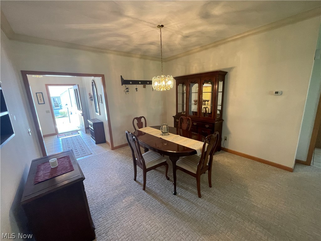 185 Mathews Road Youngstown, OH 44512 - Photo 5 of 29 Dining space with a notable chandelier and light tile floors