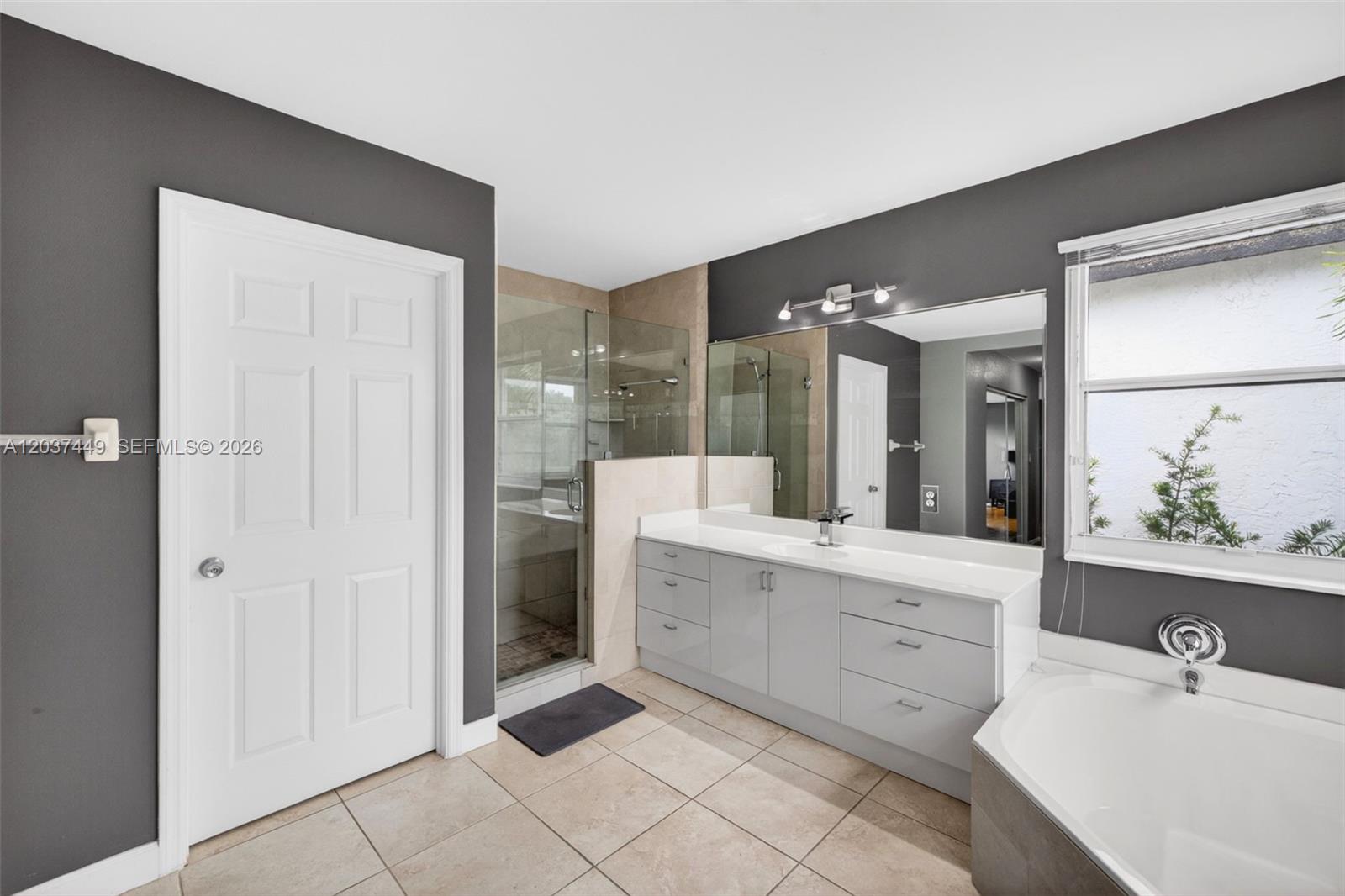 17488 Southwest 28th Court Miramar, FL 33029 - Photo 24 of 50 a bathroom with a sink vanity and a mirror