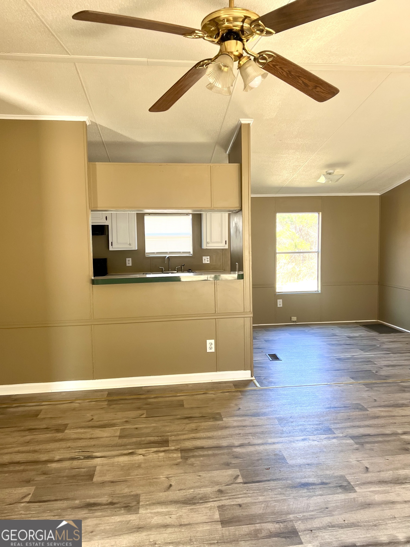 141 Shady Oaks Road Eastman, GA 31023 - Photo 15 of 26 a view of a room with window and wooden floor