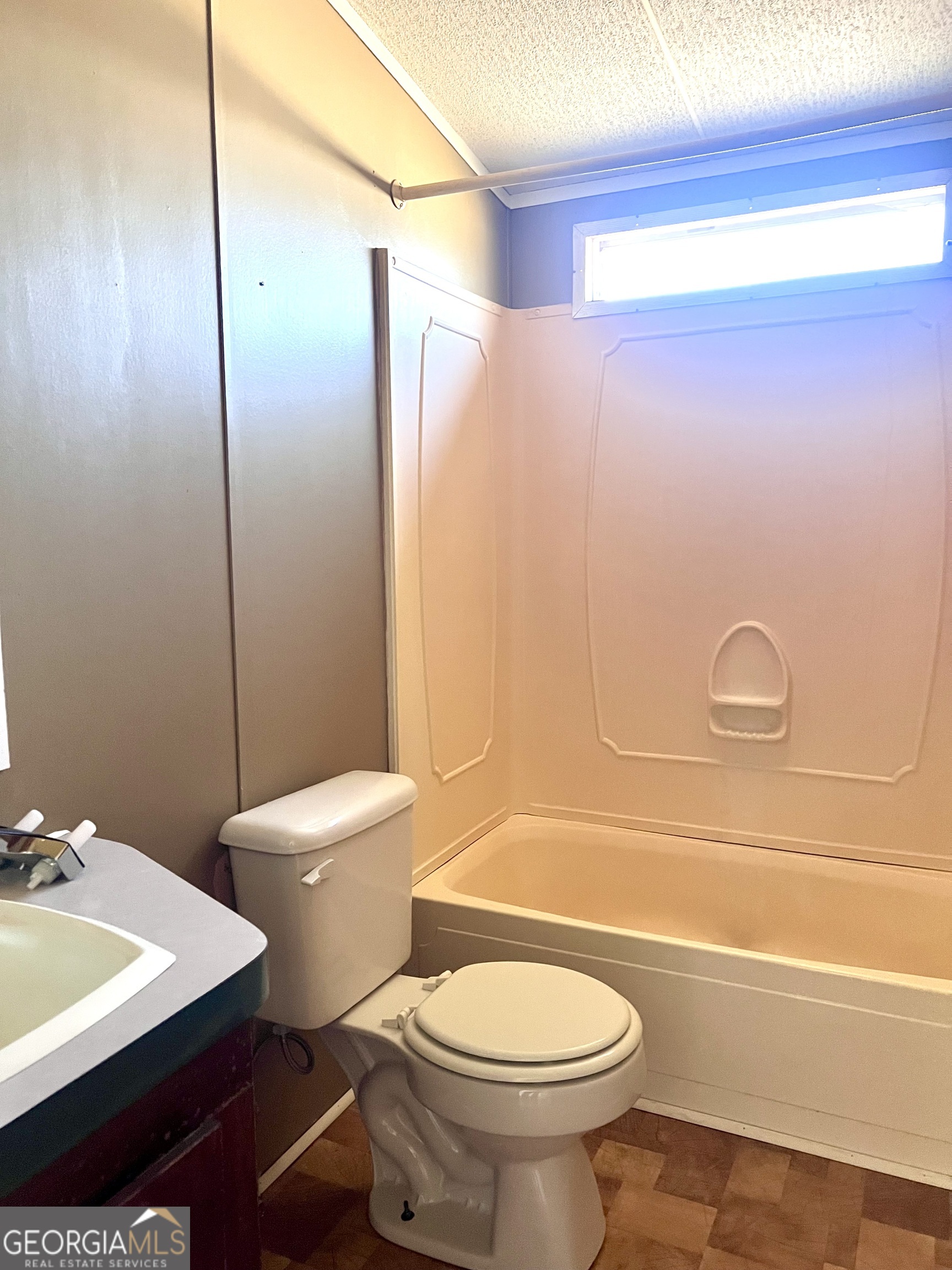 141 Shady Oaks Road Eastman, GA 31023 - Photo 26 of 26 a bathroom with a sink a toilet and shower