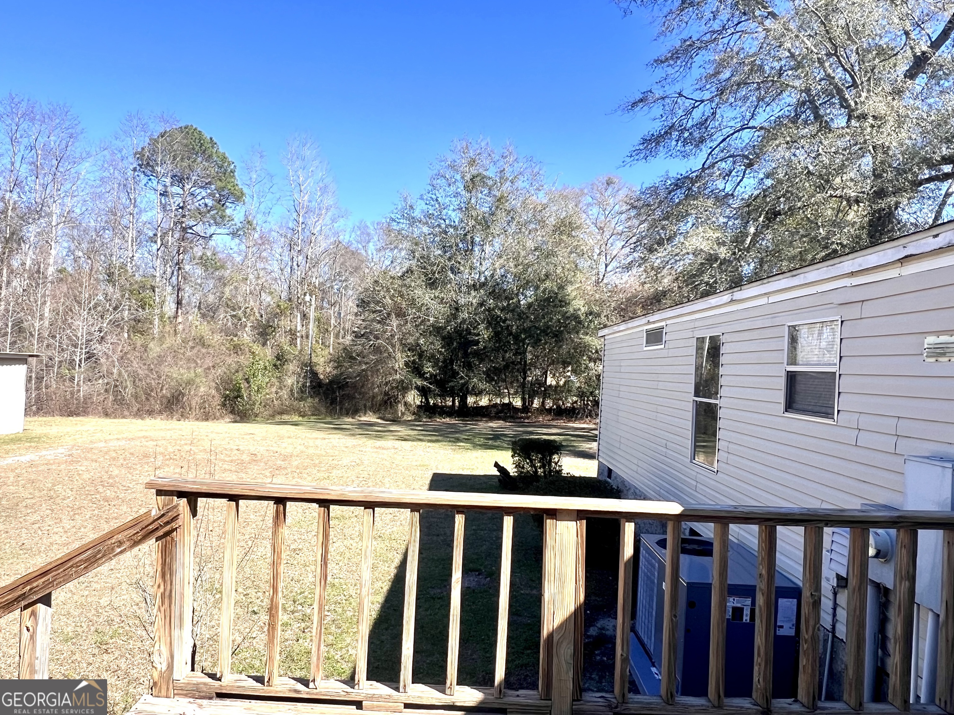 141 Shady Oaks Road Eastman, GA 31023 - Photo 5 of 26 a view of a balcony with wooden fence and floor