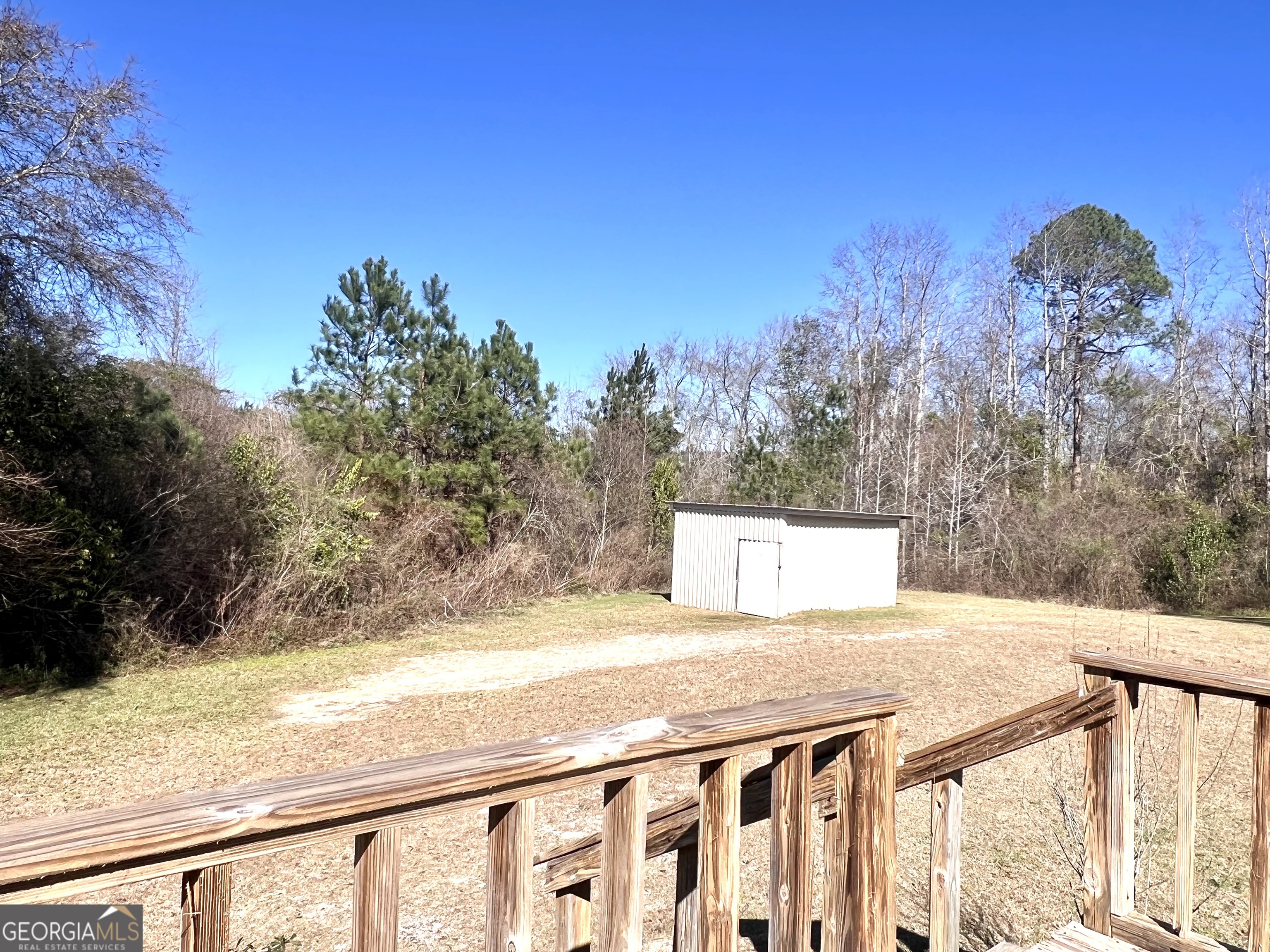 141 Shady Oaks Road Eastman, GA 31023 - Photo 6 of 26 a view of a yard with wooden fence
