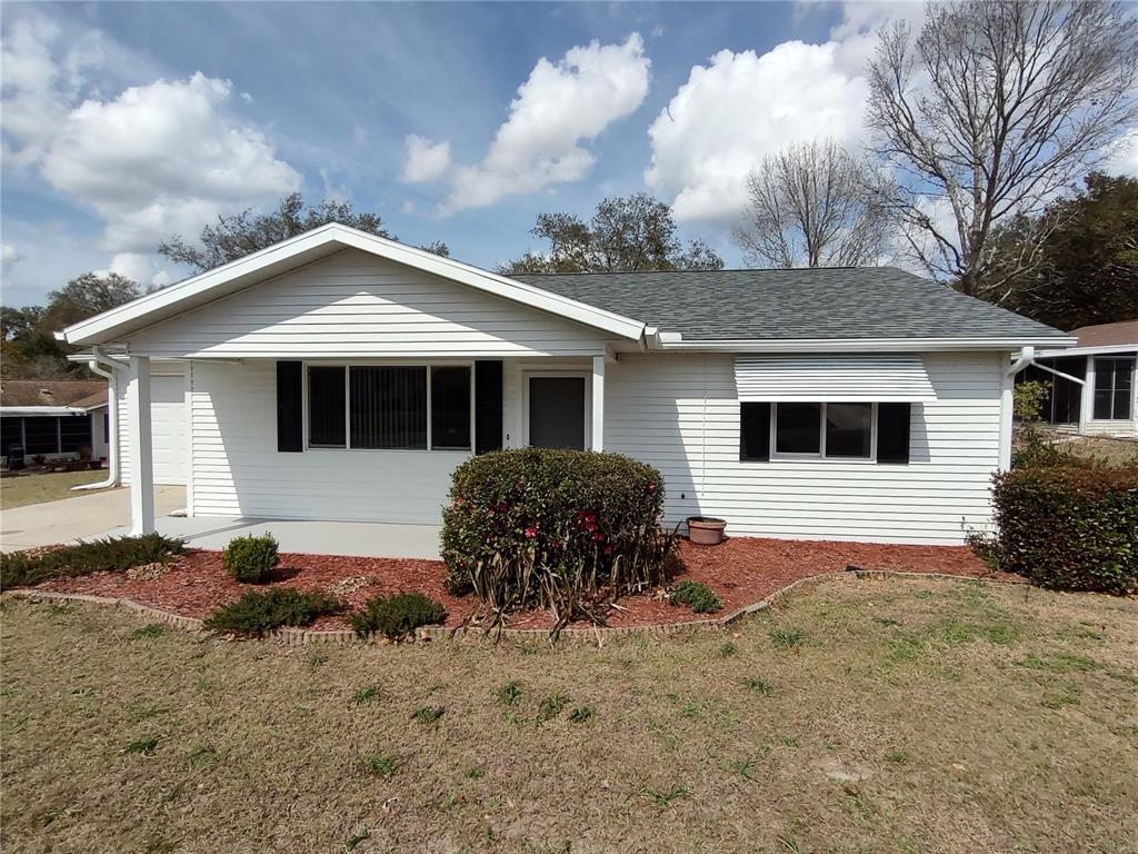 8435 Southwest 109th Lane Ocala, FL 34481 - Photo 5 of 28 a view of a house with a yard