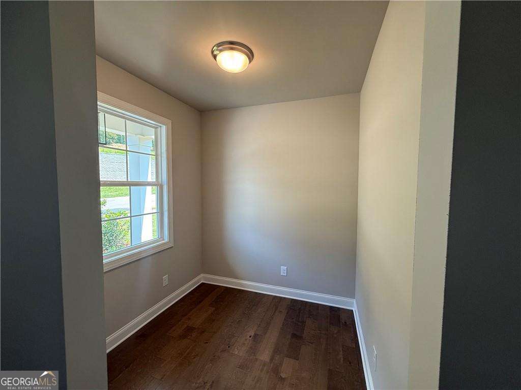 352 Lakeside Drive Canton, GA 30115 - Photo 3 of 16 an empty room with wooden floor and windows