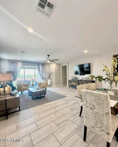 a living room with furniture or couch and a flat screen tv