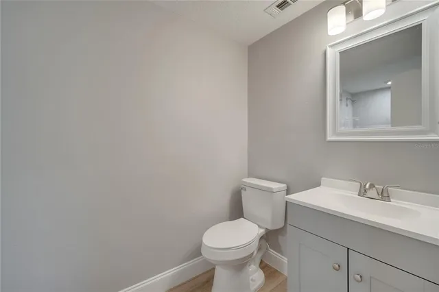 a bathroom with a wooden floor