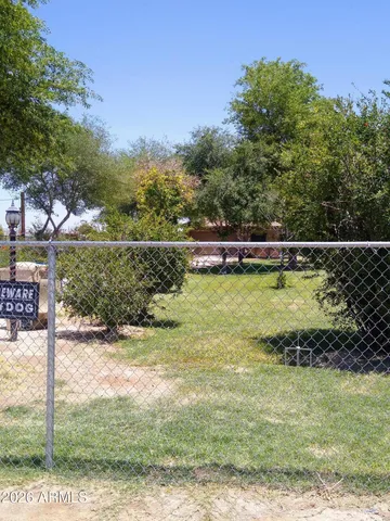 a view of a swimming pool with a yard