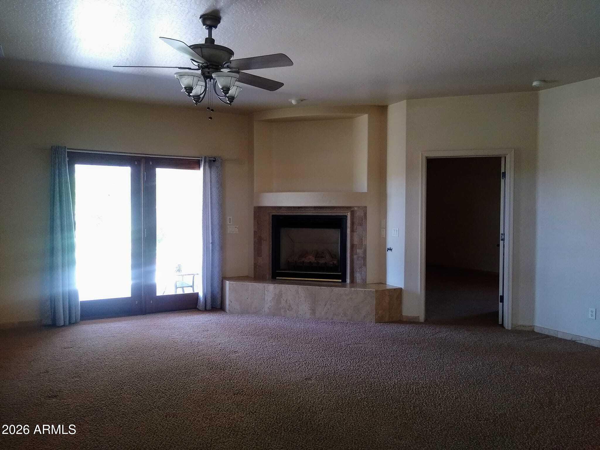 242 North Pima Road Buckeye, AZ 85326 - Photo 4 of 21 Gas fireplace