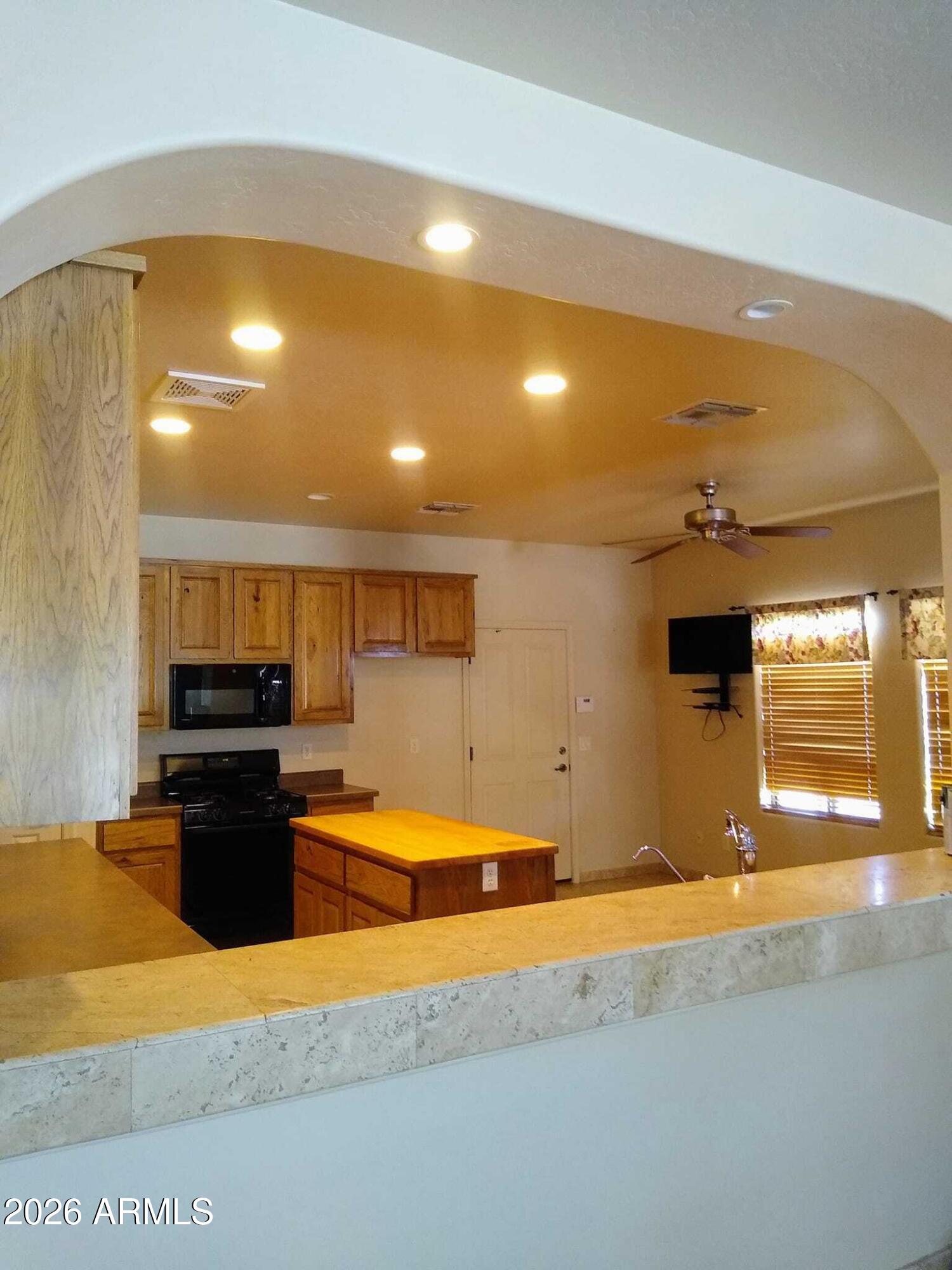 242 North Pima Road Buckeye, AZ 85326 - Photo 5 of 21 View into kitchen