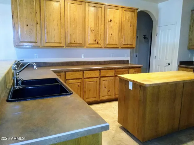 a room with a bed and cabinets