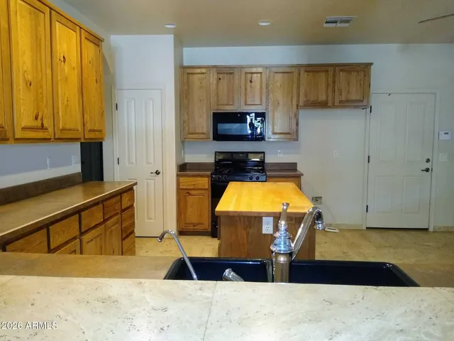 a view of kitchen with wooden floor and window