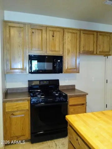 a kitchen with a stove and a microwave