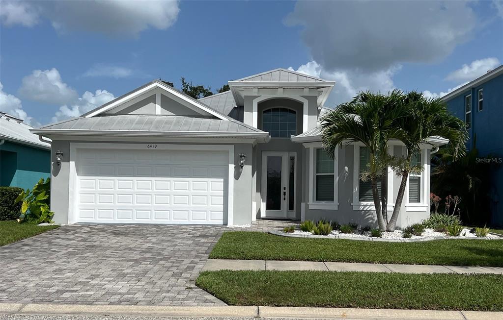 6419 Key Island Boulevard Apollo Beach, FL 33572 - Photo 1 of 1 a front view of a house with a yard