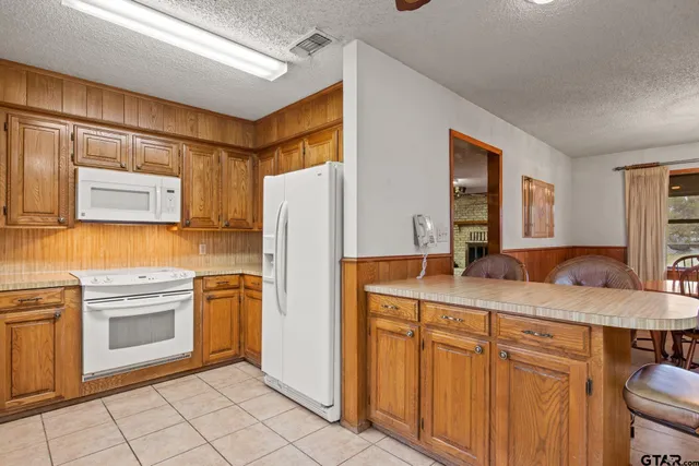 a kitchen with cabinets a sink and appliances