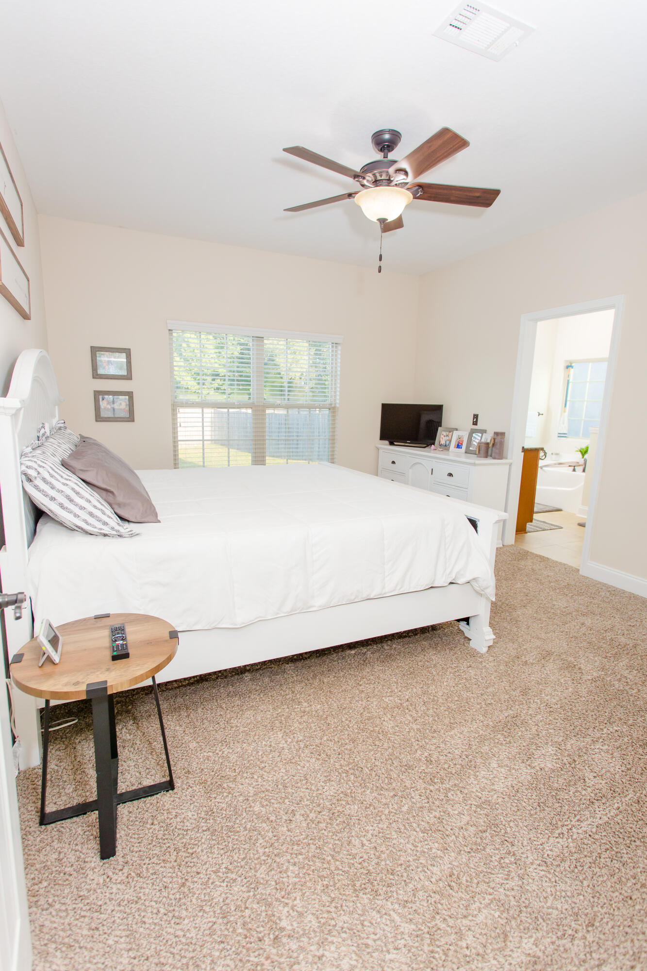 4544 Live Oak Church Road Crestview, FL 32539 - Photo 14 of 31 a living room with a bed furniture and a window