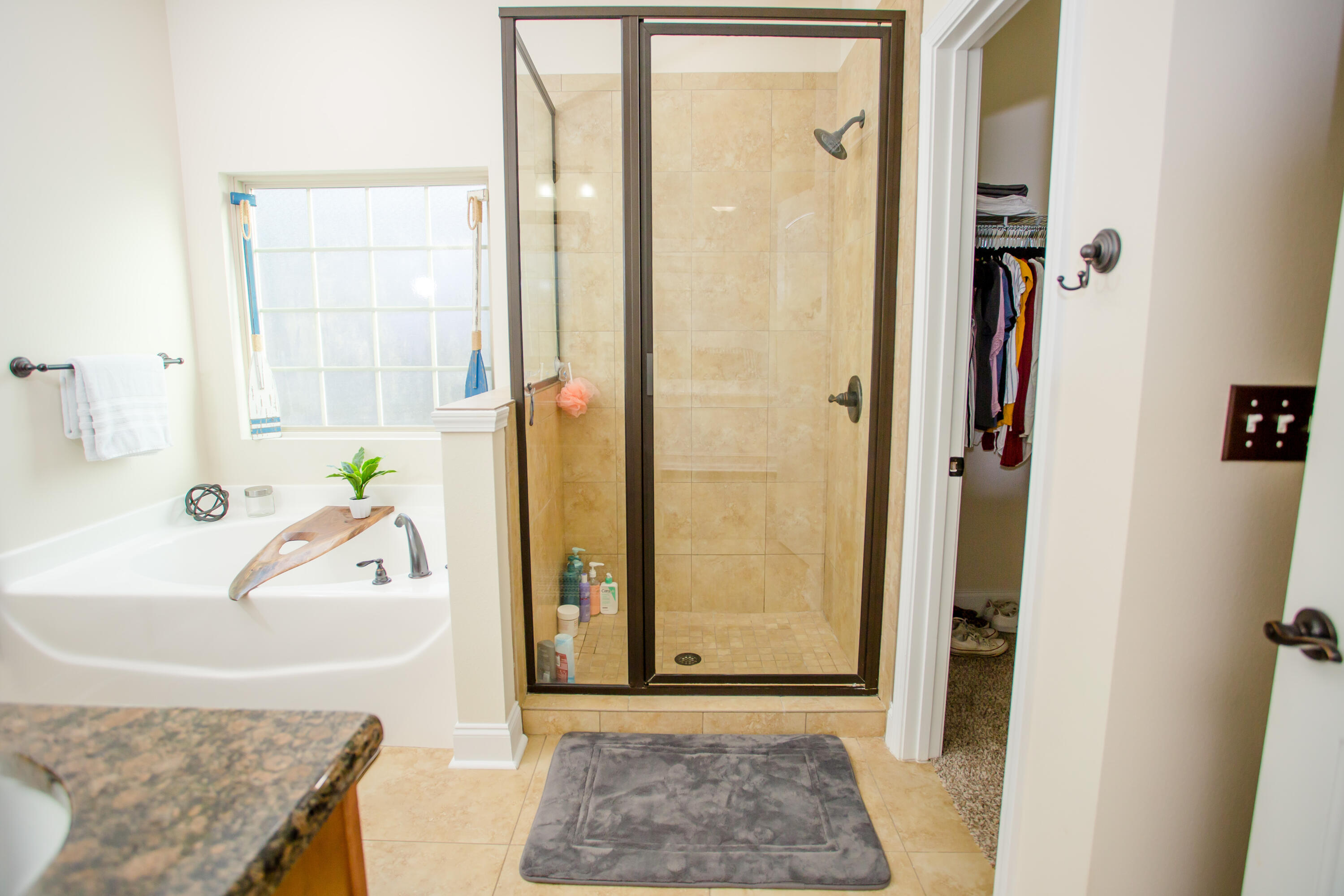 4544 Live Oak Church Road Crestview, FL 32539 - Photo 16 of 31 a bathroom with a granite countertop tub sink and shower
