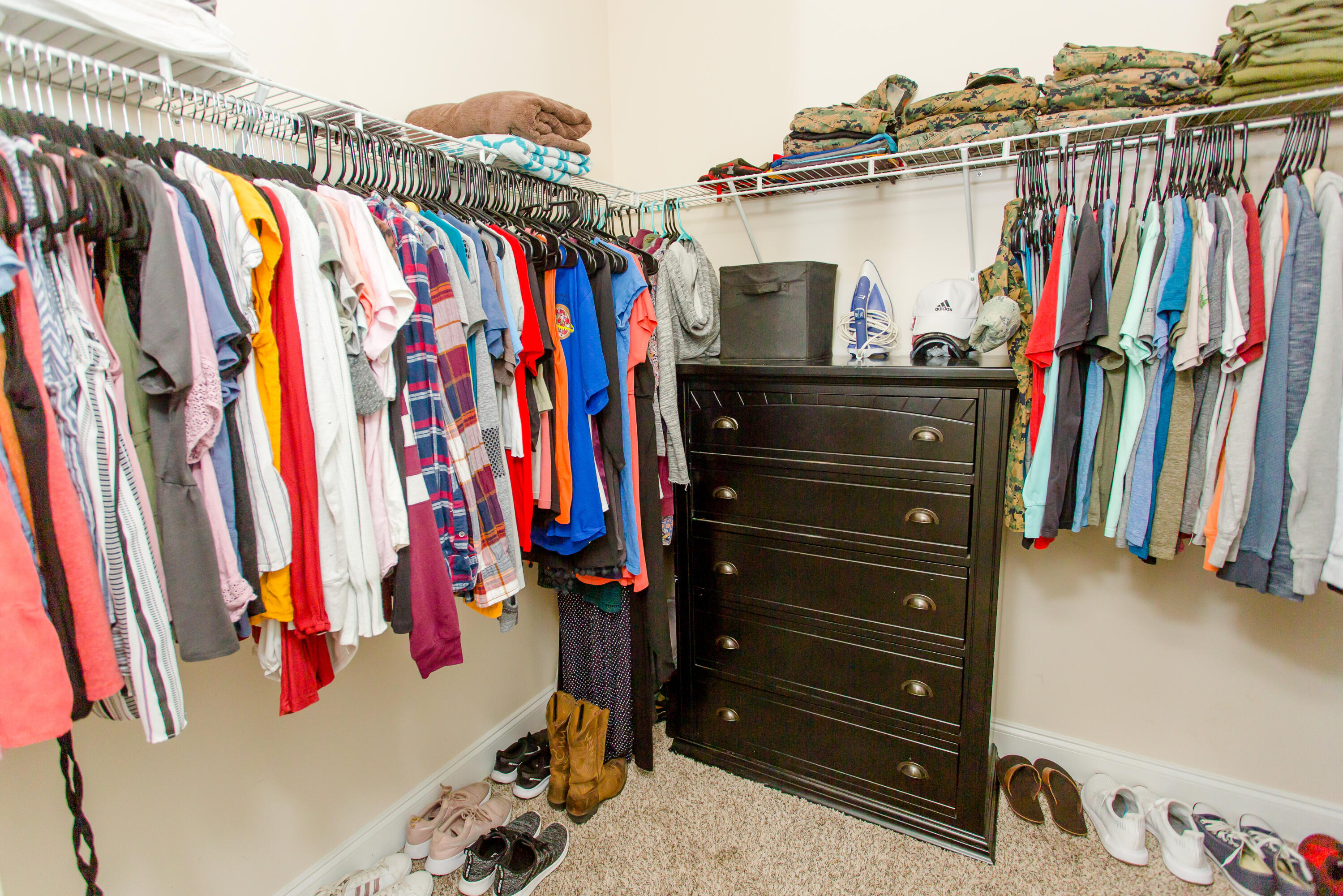 4544 Live Oak Church Road Crestview, FL 32539 - Photo 20 of 31 a view of walk in closet with clothes and shoes