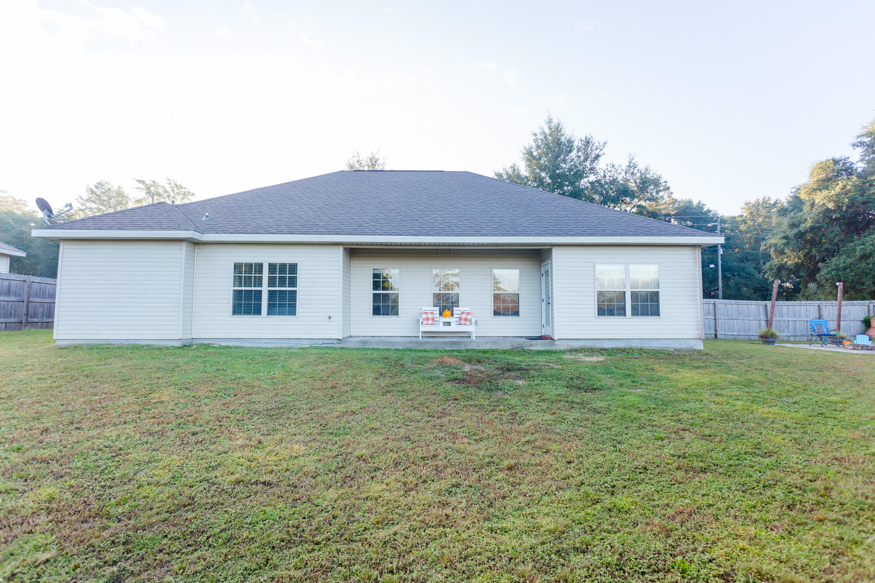 4544 Live Oak Church Road Crestview, FL 32539 - Photo 4 of 31 a front view of a house with a garden