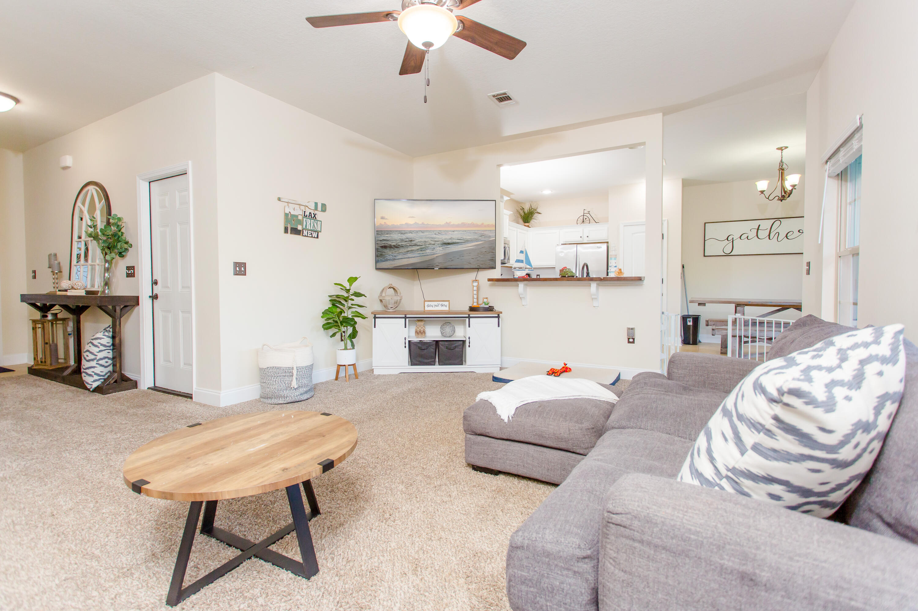 4544 Live Oak Church Road Crestview, FL 32539 - Photo 8 of 31 a living room with furniture and a chandelier