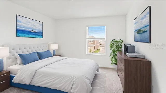 a bedroom with bed and a couch