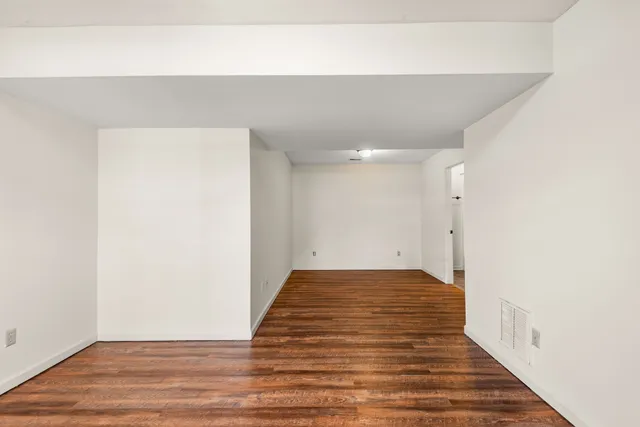 a view of a big room with wooden floor