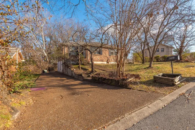 a view of a street with houses on both side