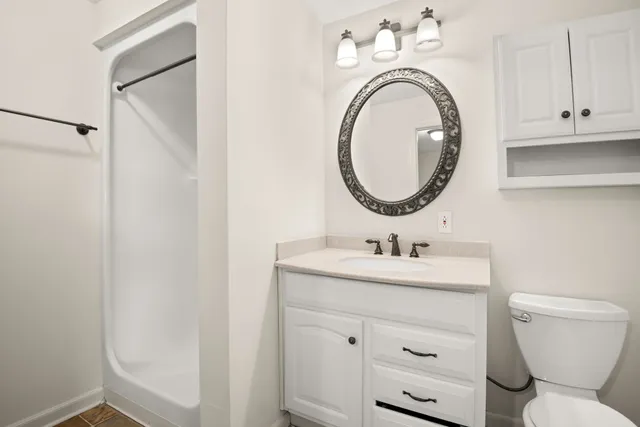 a bathroom with a toilet and a sink