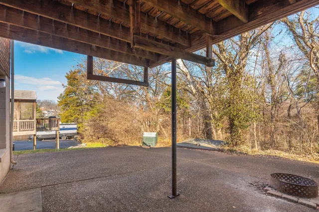 a yellow house with trees in front of it