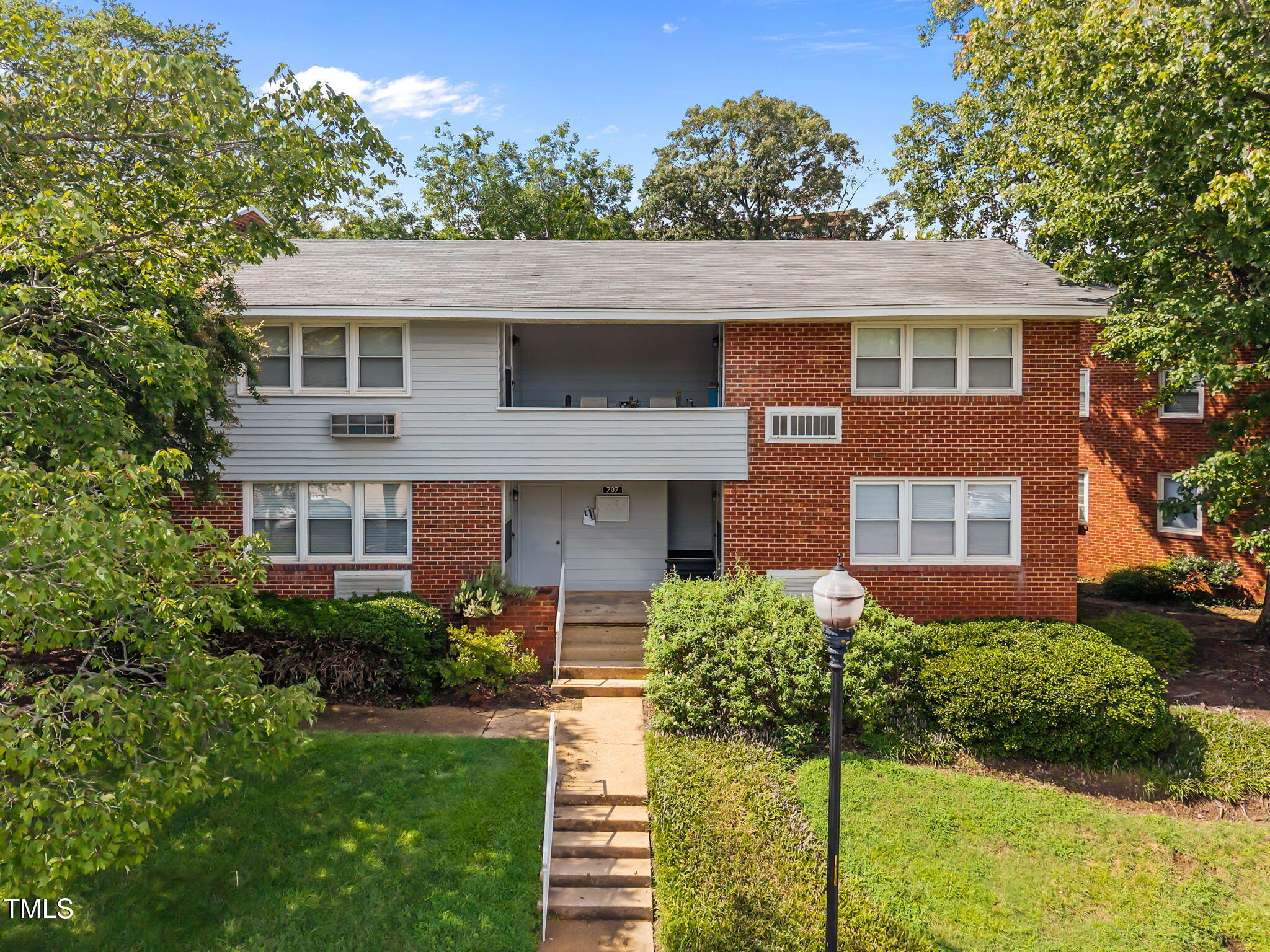 707 Daniels Street, Unit B Raleigh, NC 27605 - Photo 1 of 22 a front view of a house with a yard