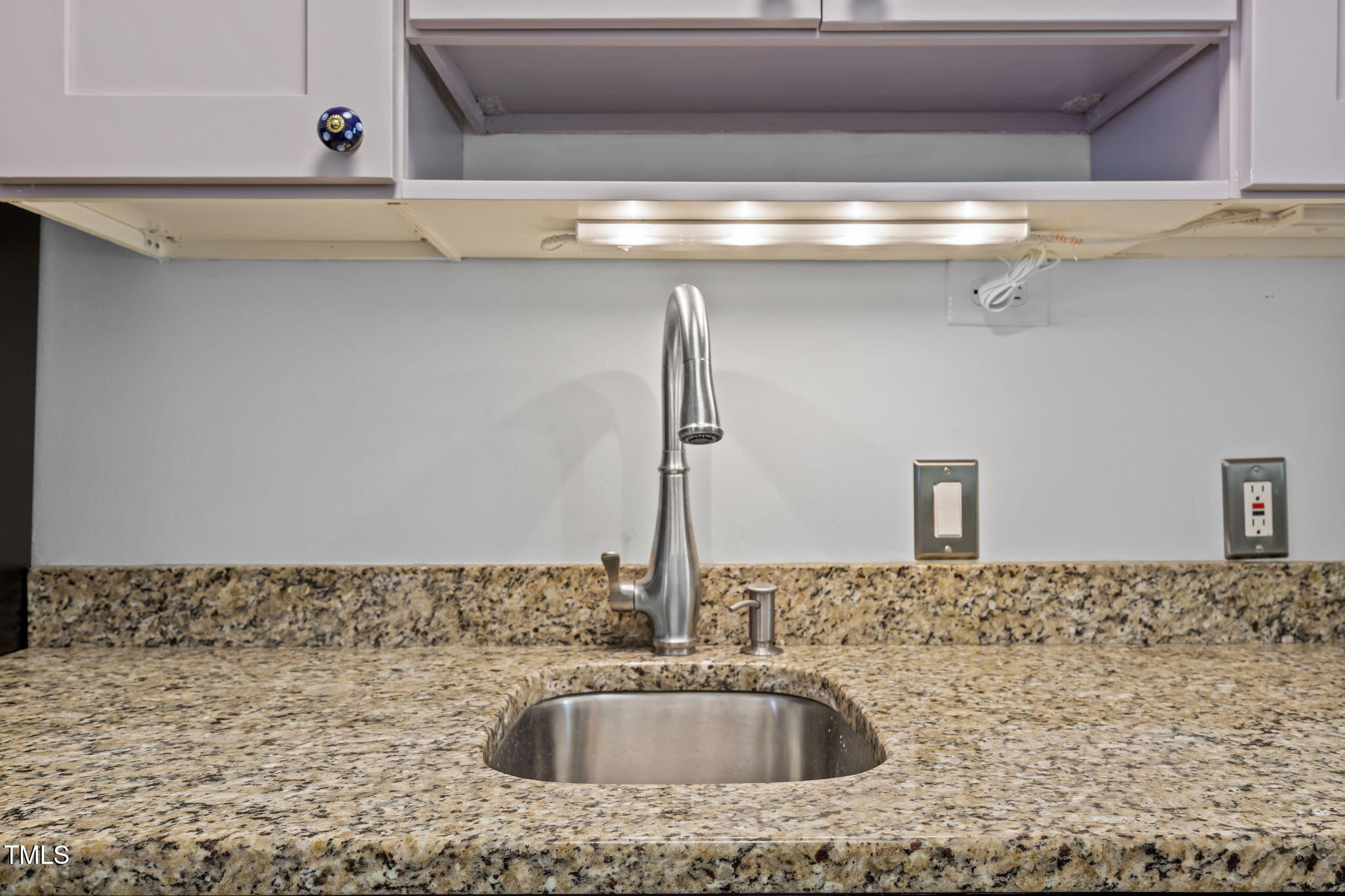 707 Daniels Street, Unit B Raleigh, NC 27605 - Photo 15 of 22 a bathroom with a sink and a mirror