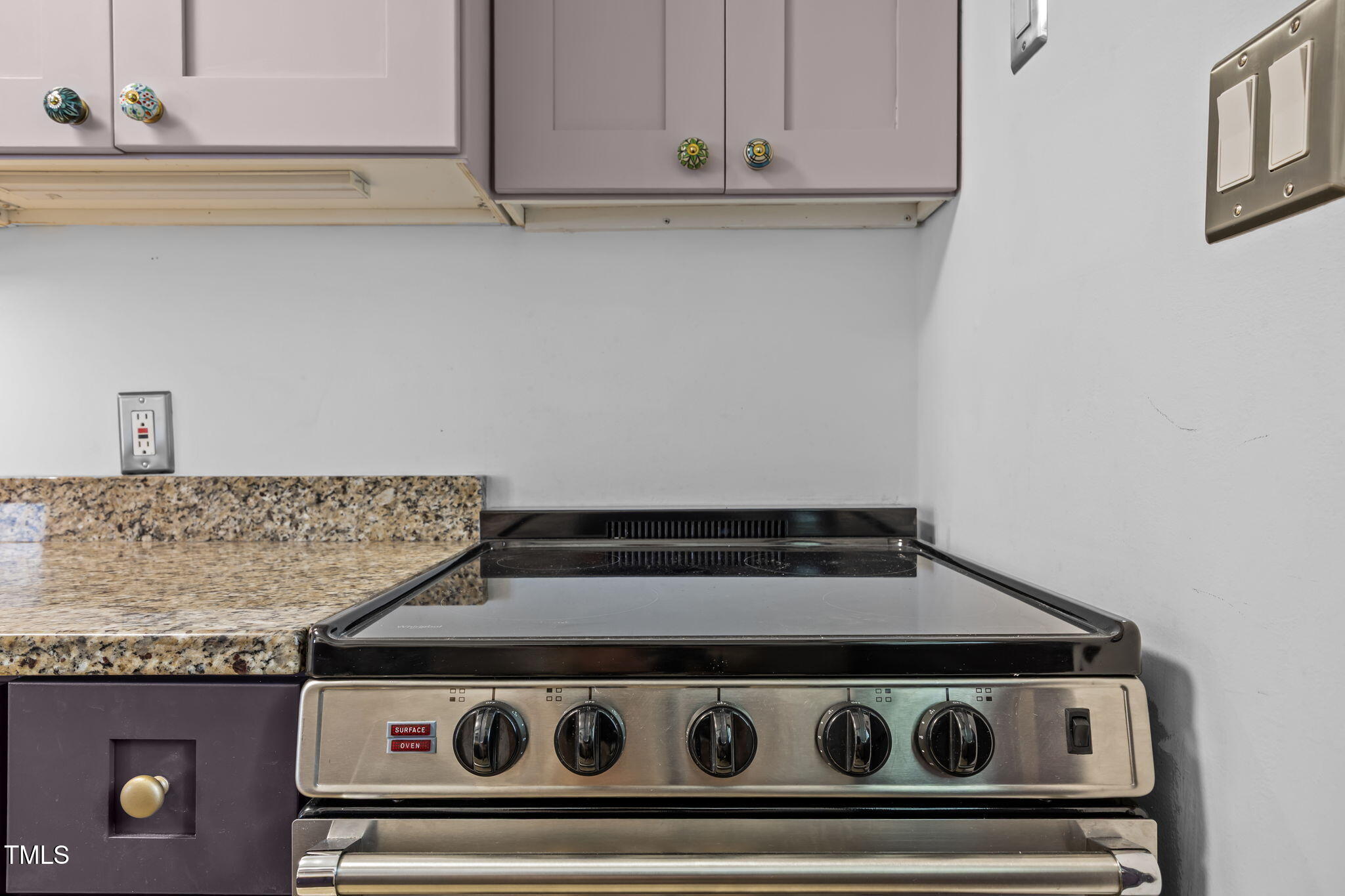 707 Daniels Street, Unit B Raleigh, NC 27605 - Photo 16 of 22 a stove top oven sitting inside of a kitchen