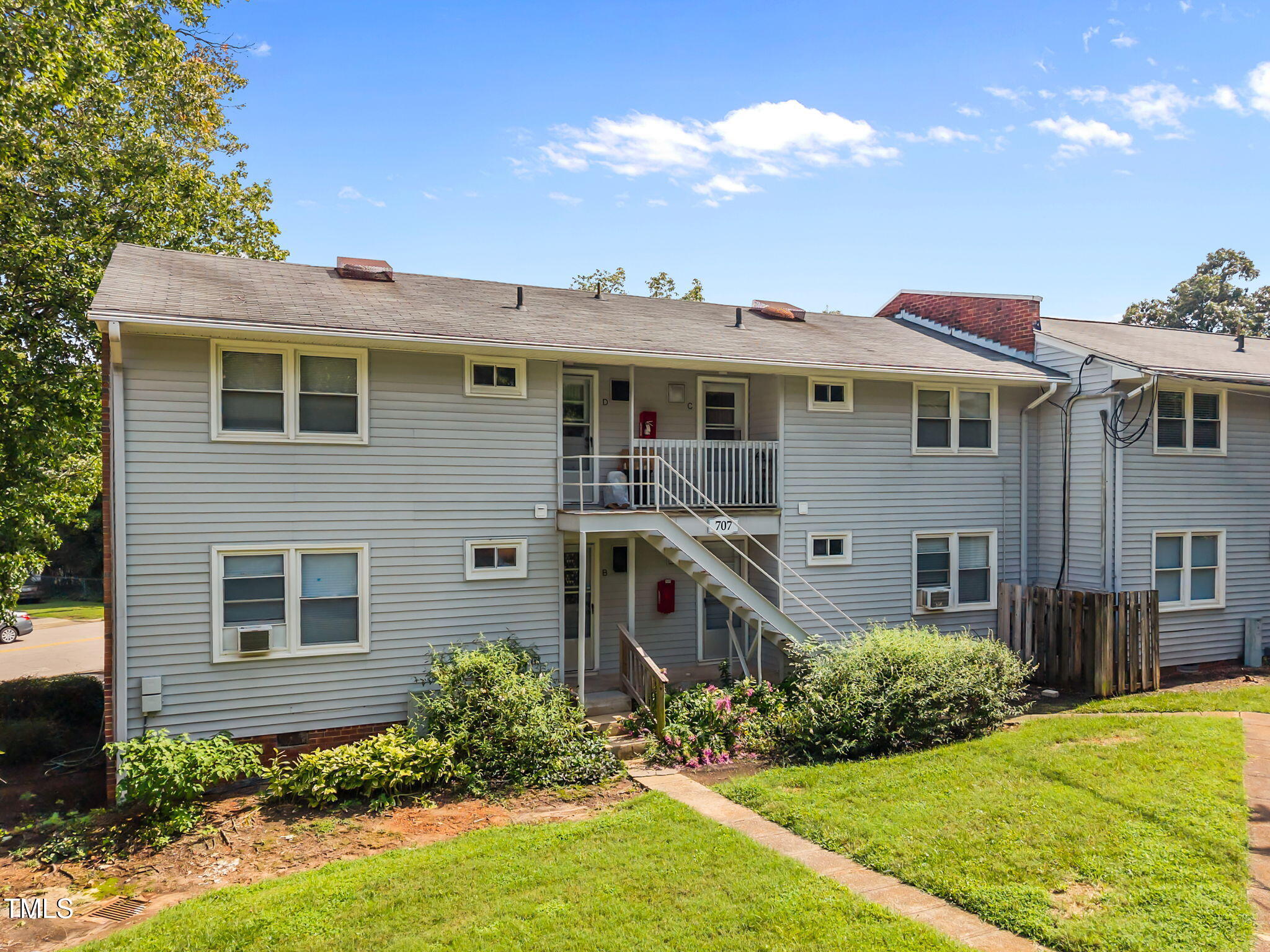707 Daniels Street, Unit B Raleigh, NC 27605 - Photo 18 of 22 a front view of a house with garden