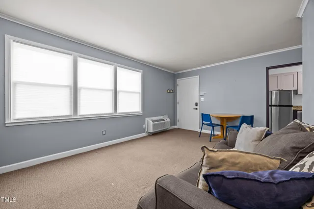 a living room with a furniture and a window