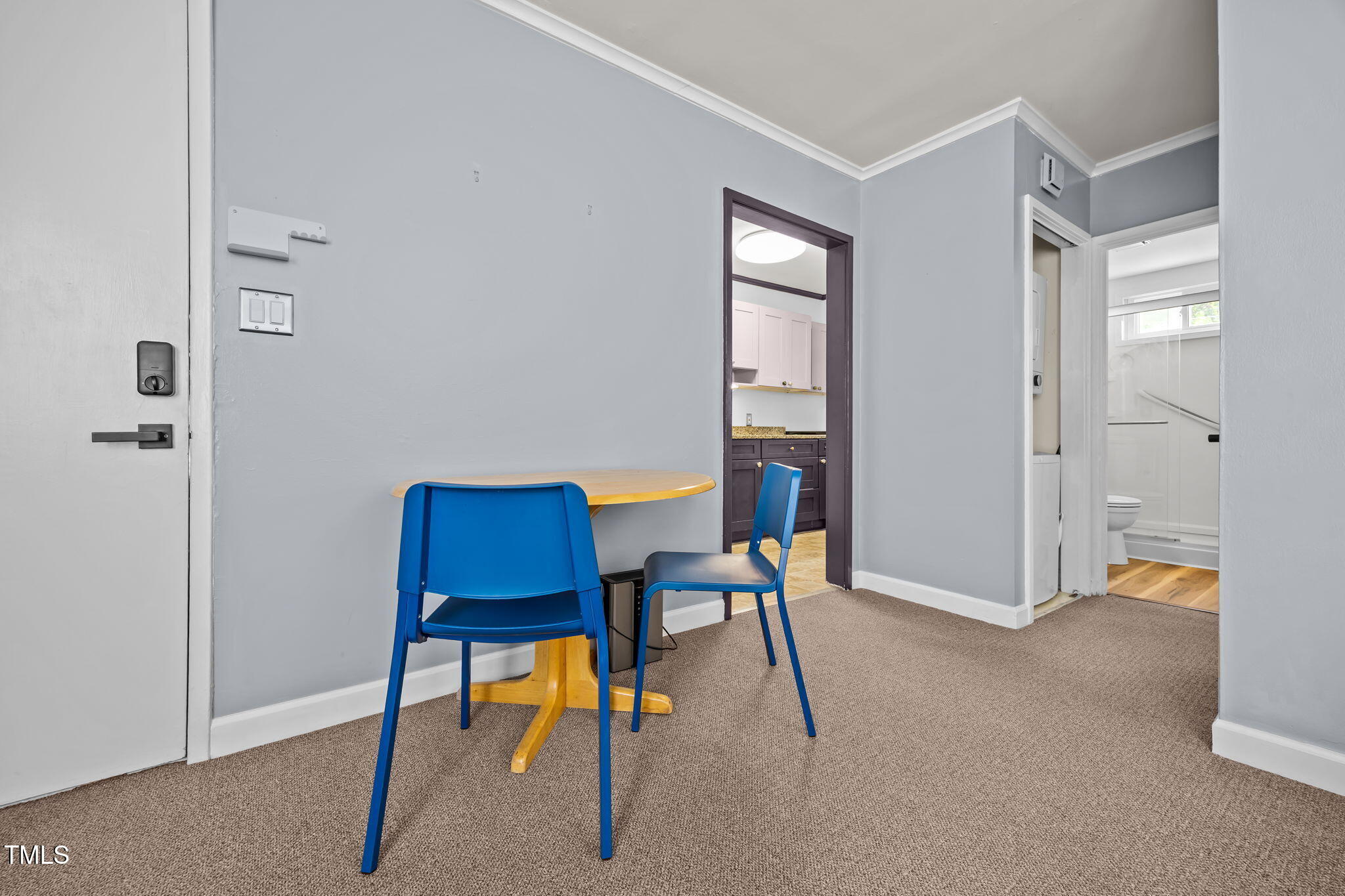 707 Daniels Street, Unit B Raleigh, NC 27605 - Photo 8 of 22 a room with furniture and a window