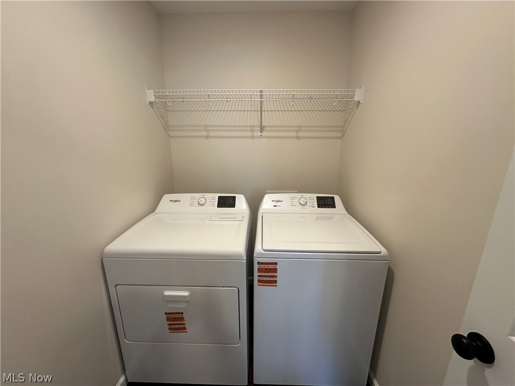 363 Sexton Street Struthers, OH 44471 - Photo 9 of 20 Laundry area with washer and dryer, and a wire storage shelf