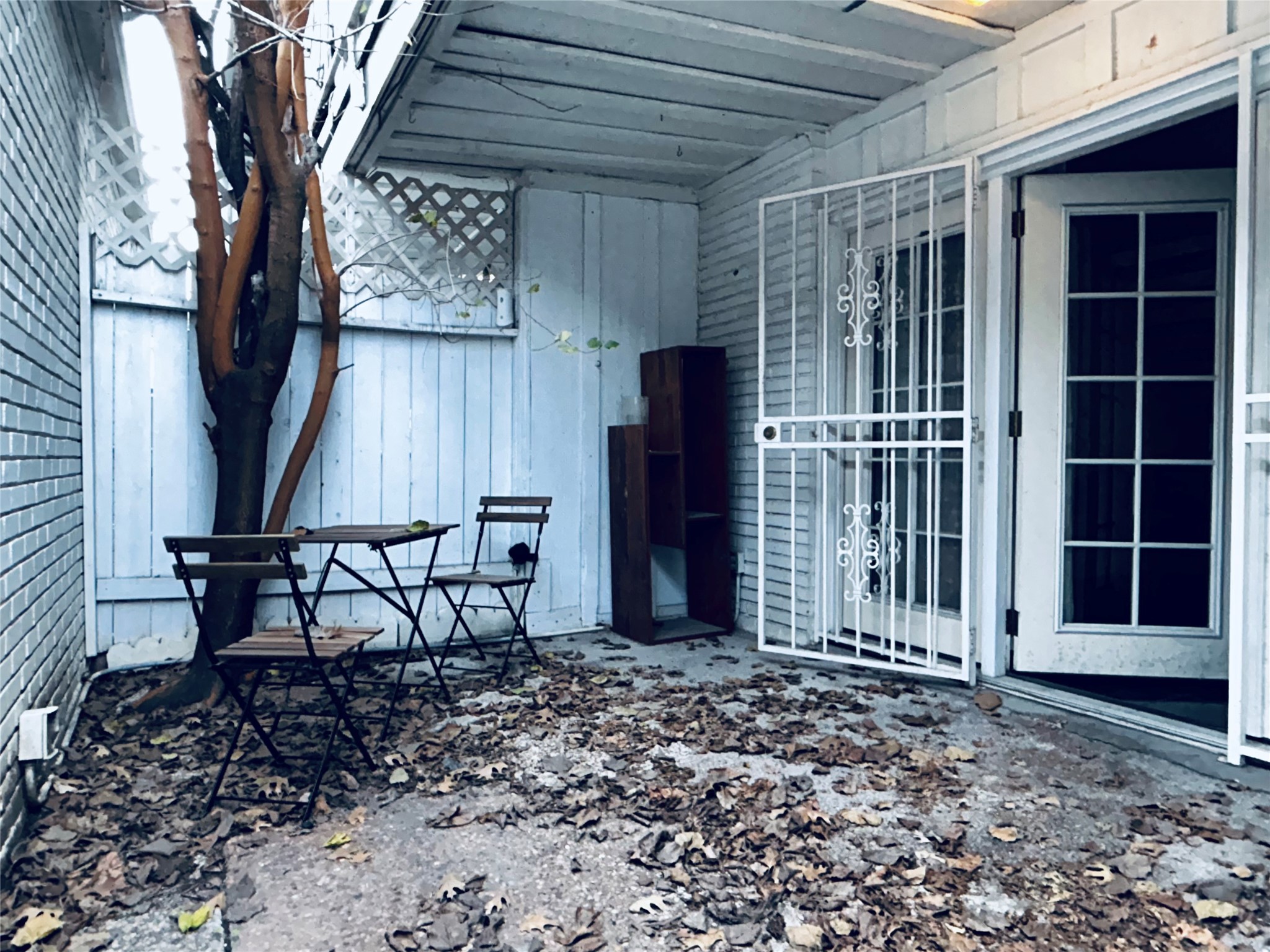 7825 Rue St Cyr Street, Unit 53 Houston, TX 77074 - Photo 11 of 11 a view of a chairs and table in backyard